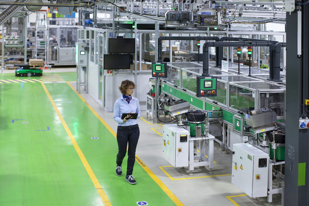 Person walking in a smart factory